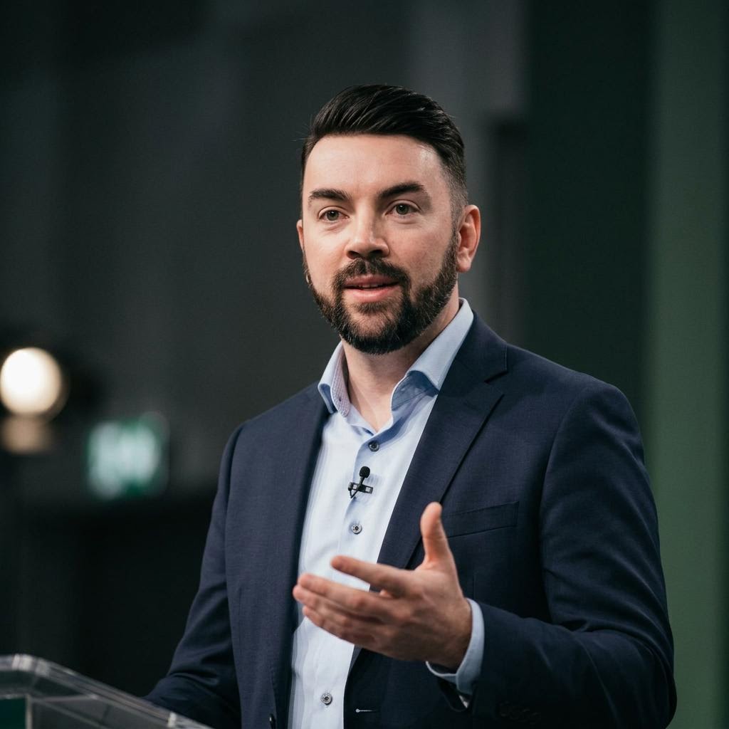 AI styled editorial portrait of John P. Cronin presenting in a conference setting
